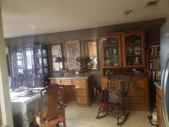 4415 Smallwood Road Reno, TX 75462 - Photo 26 of 39 a room with lots of wooden furniture and windows