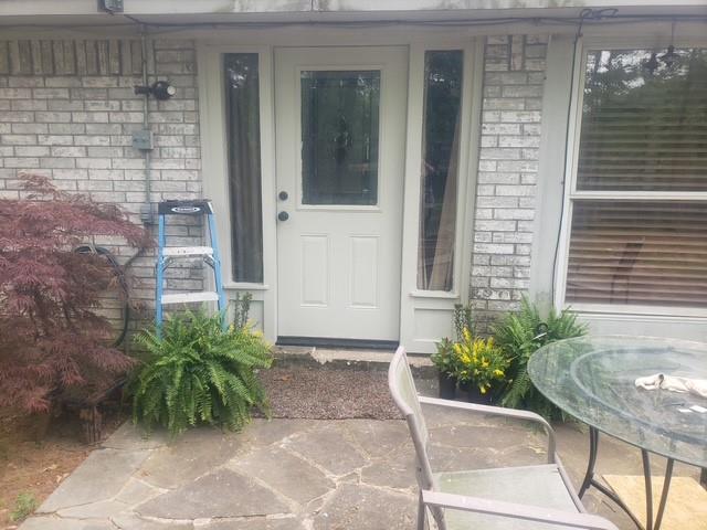 4415 Smallwood Road Reno, TX 75462 - Photo 3 of 39 a potted plant sitting in front of a door