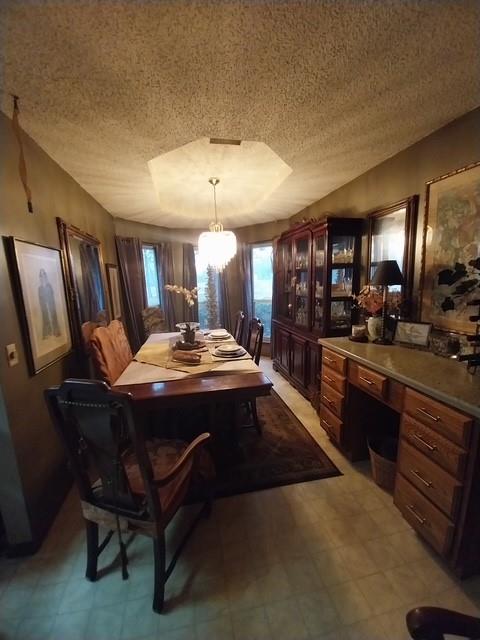 4415 Smallwood Road Reno, TX 75462 - Photo 32 of 39 a kitchen with a table chairs refrigerator and microwave