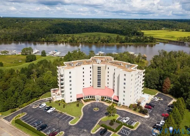 an aerial view of a house with a lake view