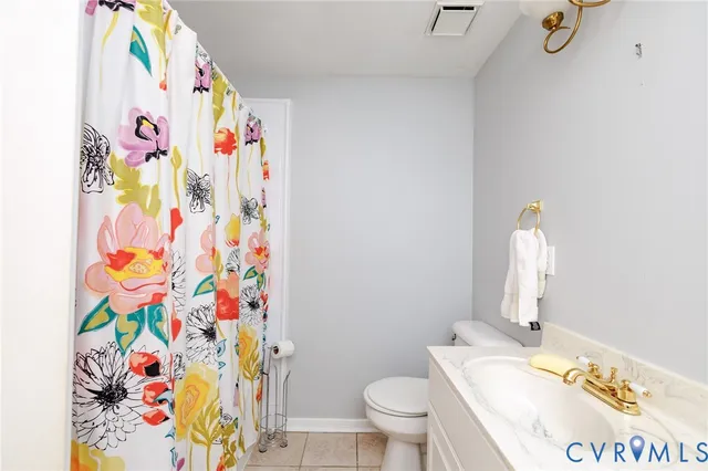 a bathroom with a sink vanity and a mirror