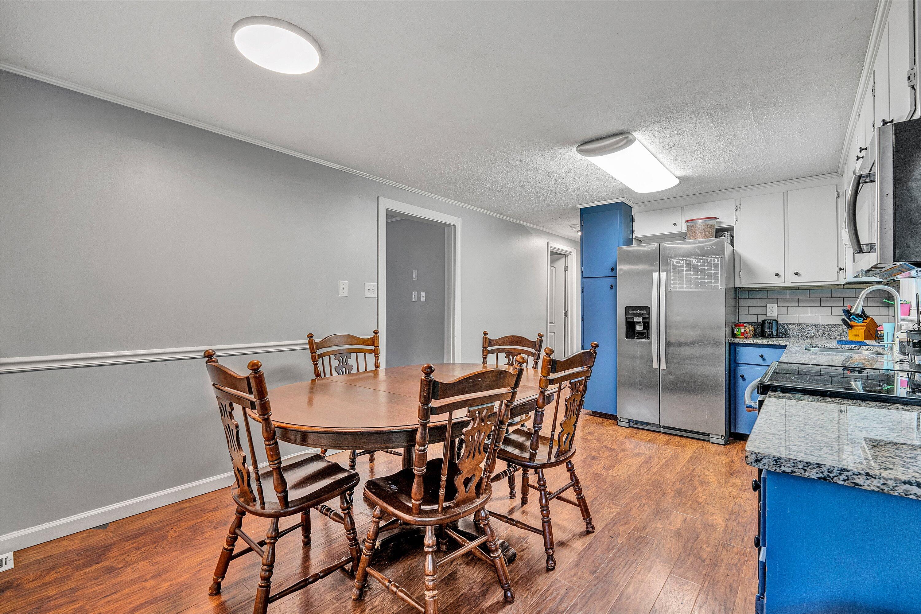 2095 Webster Road Glade Hill, VA 24092 - Photo 6 of 20 a view of a dining room with furniture and wooden floor