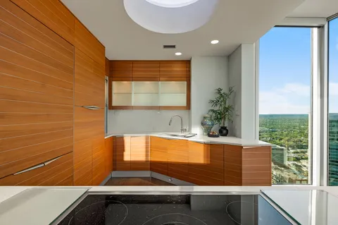 a room with pool table and windows