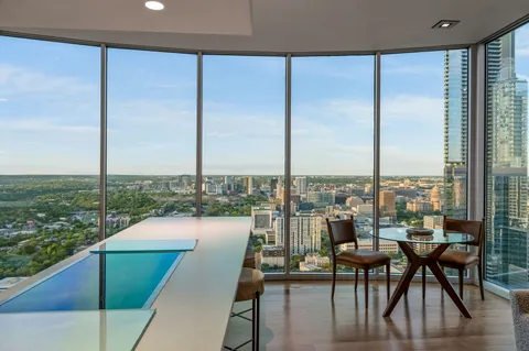 a view of a dining room with furniture window and outside view