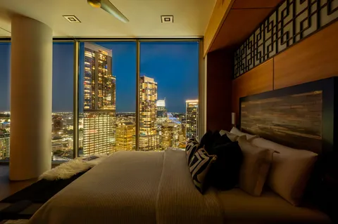 a dining room with furniture wooden floor and a chandelier