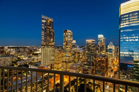 a view of a balcony with city view