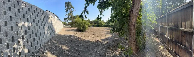 a view of a backyard of the house
