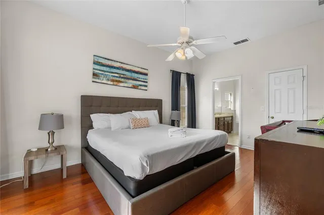 a spacious bathroom with a double vanity sink mirror and shower