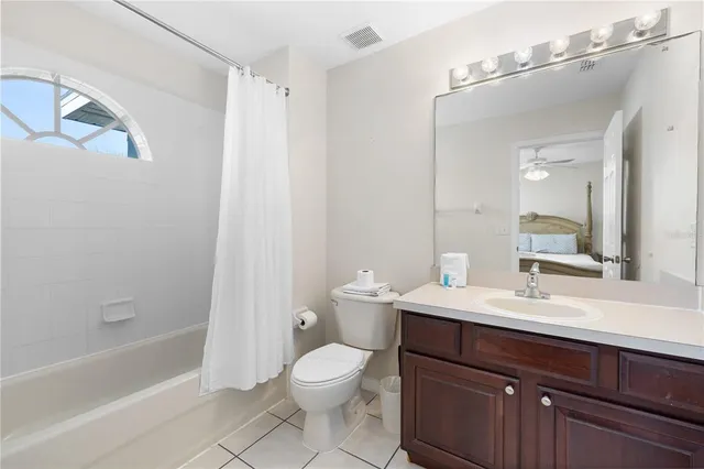 a room with gym equipment and wooden floor