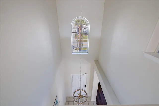 an aerial view of a residential apartment building with a yard and seating area