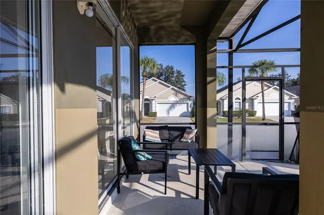 an aerial view of a houses with a swimming pool