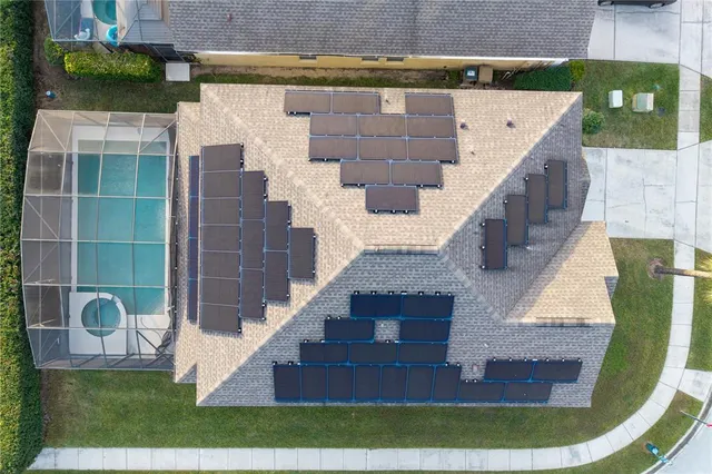 an aerial view of residential houses with outdoor space
