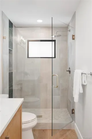 a bathroom with a shower and a toilet