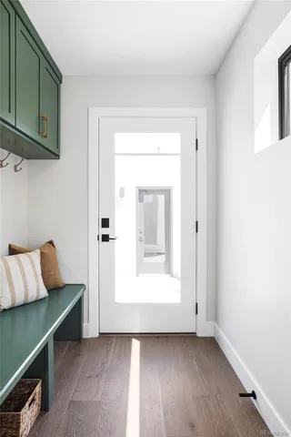 a view of room with furniture and wooden floor