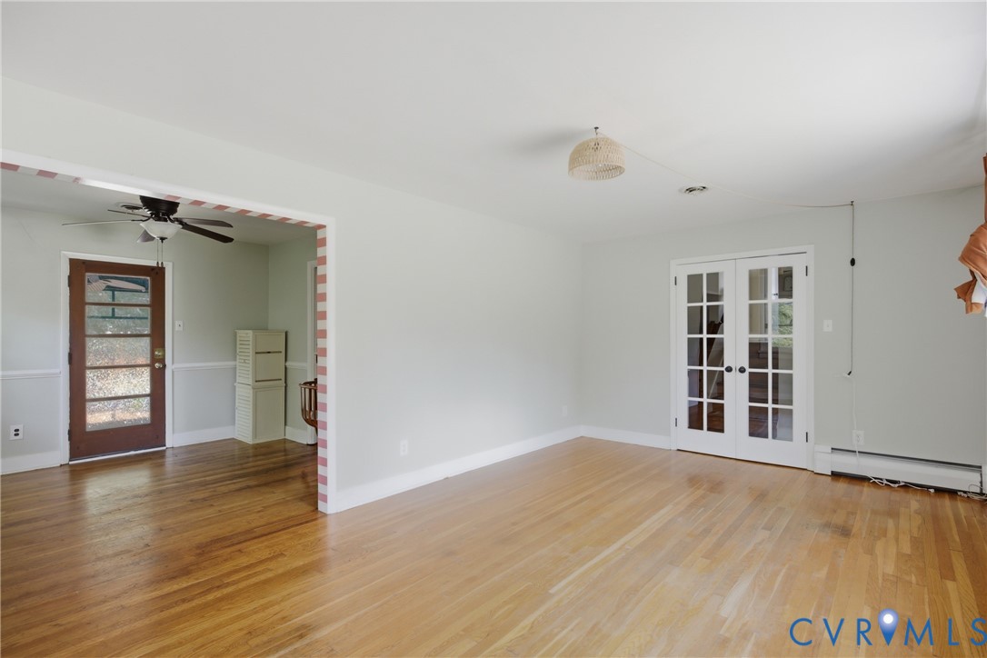8210 Ireton Road Henrico, VA 23228 - Photo 6 of 36 wooden floor in an empty room with a window