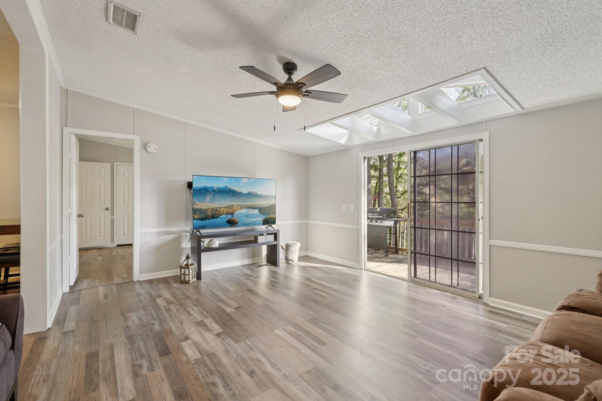 1269 Eastcreek Road Fort Lawn, SC 29714 - Photo 13 of 44 a living room with furniture and a wooden floor