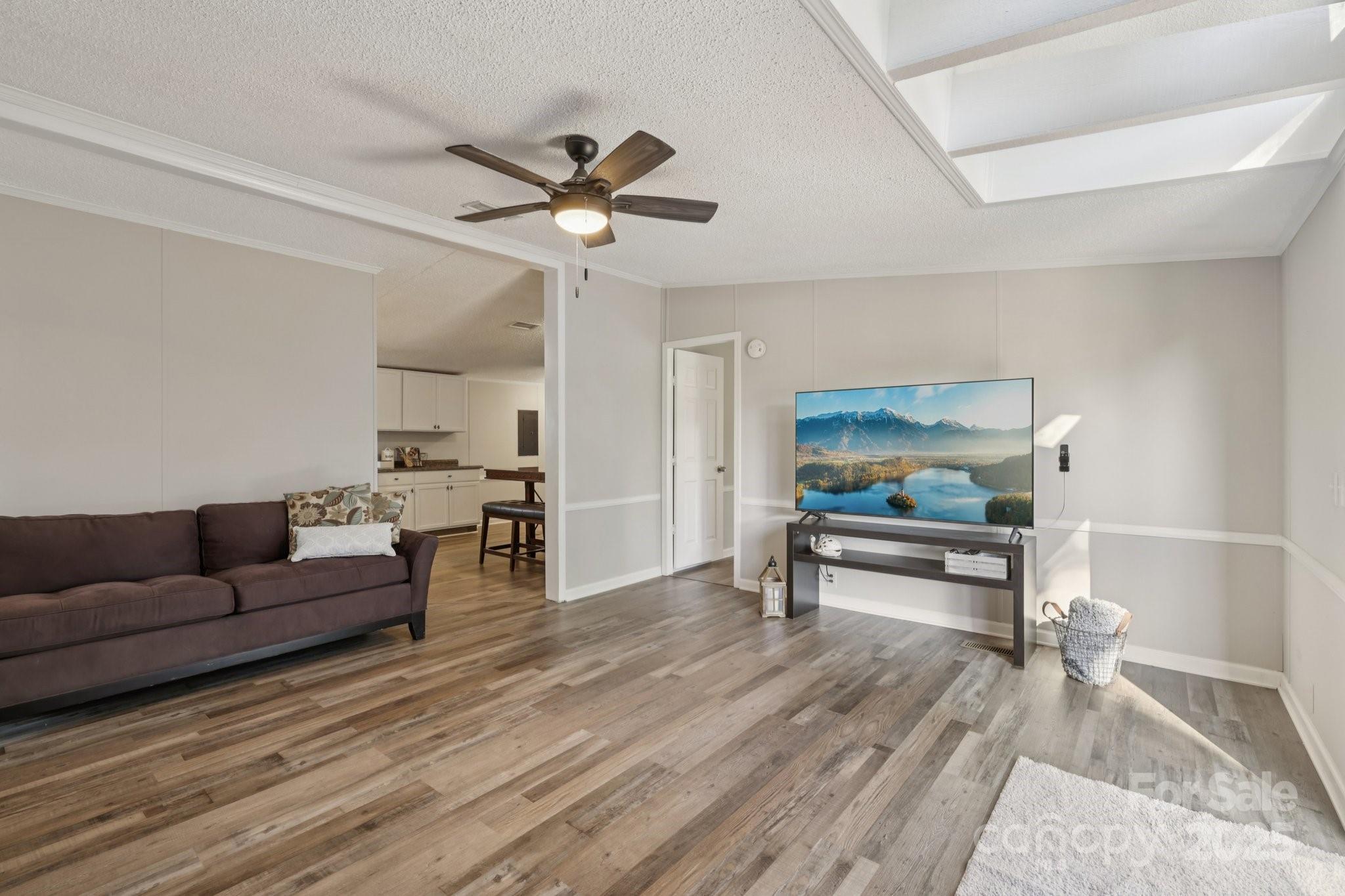 1269 Eastcreek Road Fort Lawn, SC 29714 - Photo 14 of 44 a living room with furniture and a wooden floor