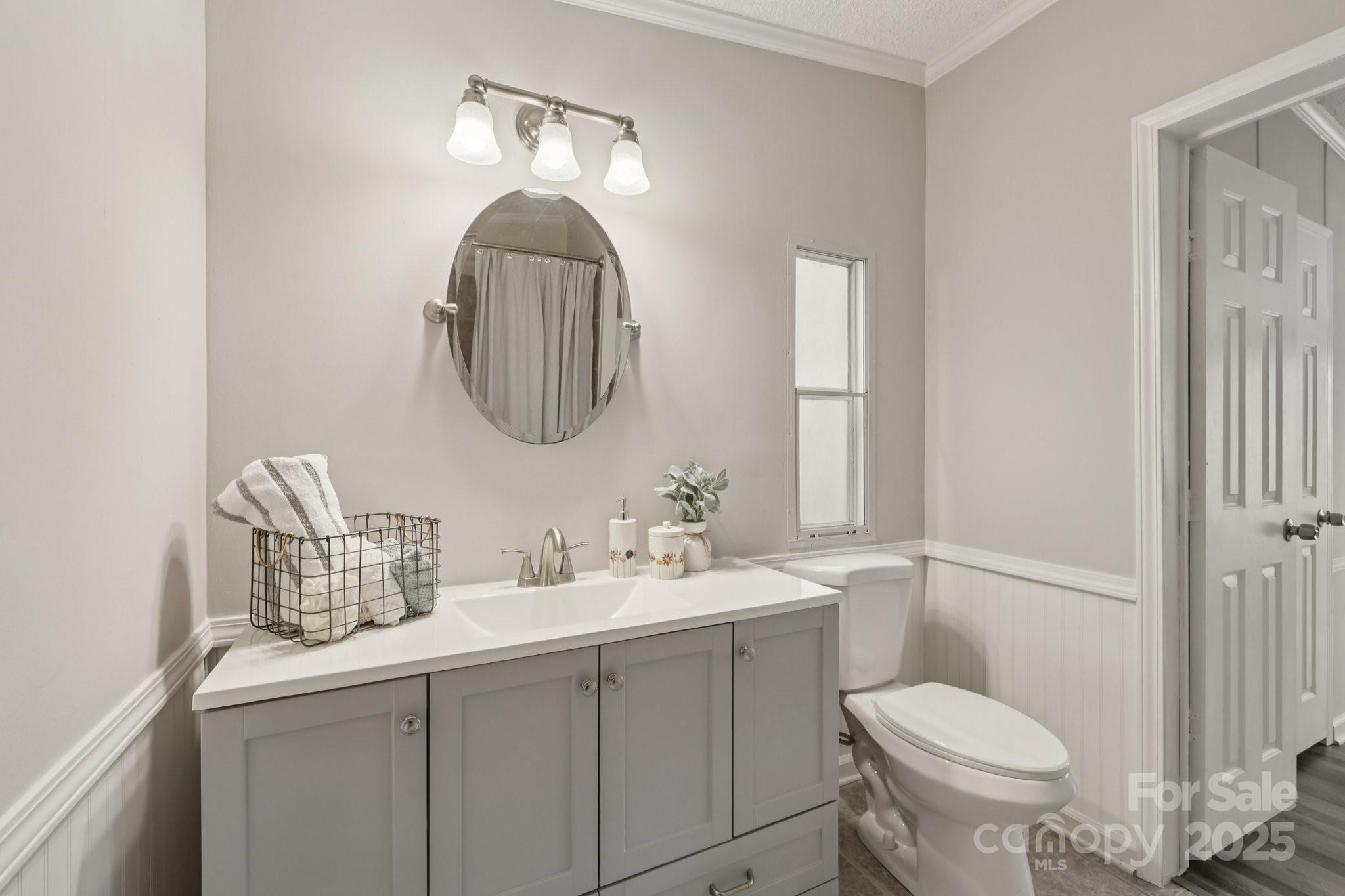 1269 Eastcreek Road Fort Lawn, SC 29714 - Photo 20 of 44 a bathroom with a toilet sink and mirror