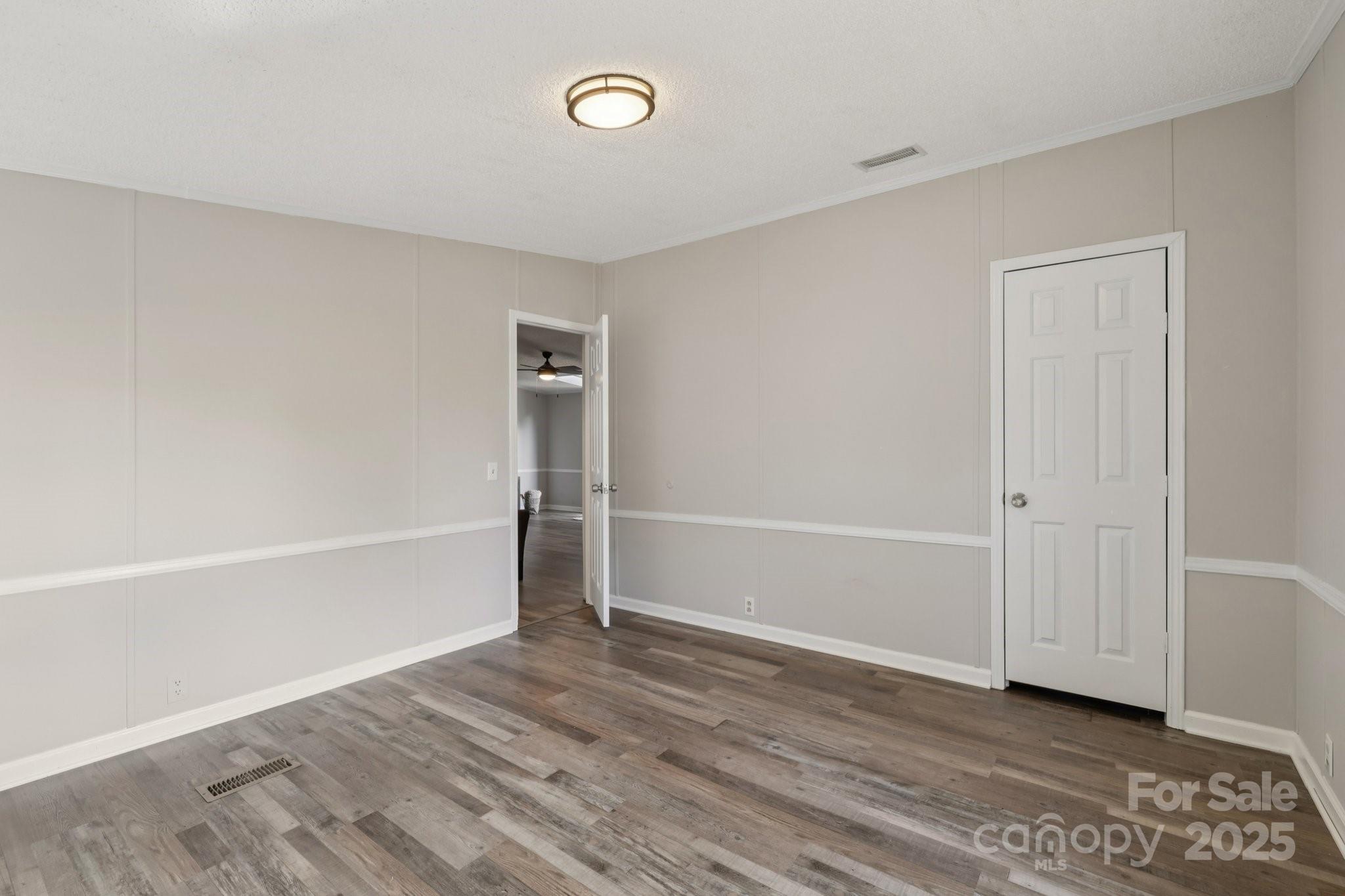 1269 Eastcreek Road Fort Lawn, SC 29714 - Photo 23 of 44 a view of an empty room with wooden floor