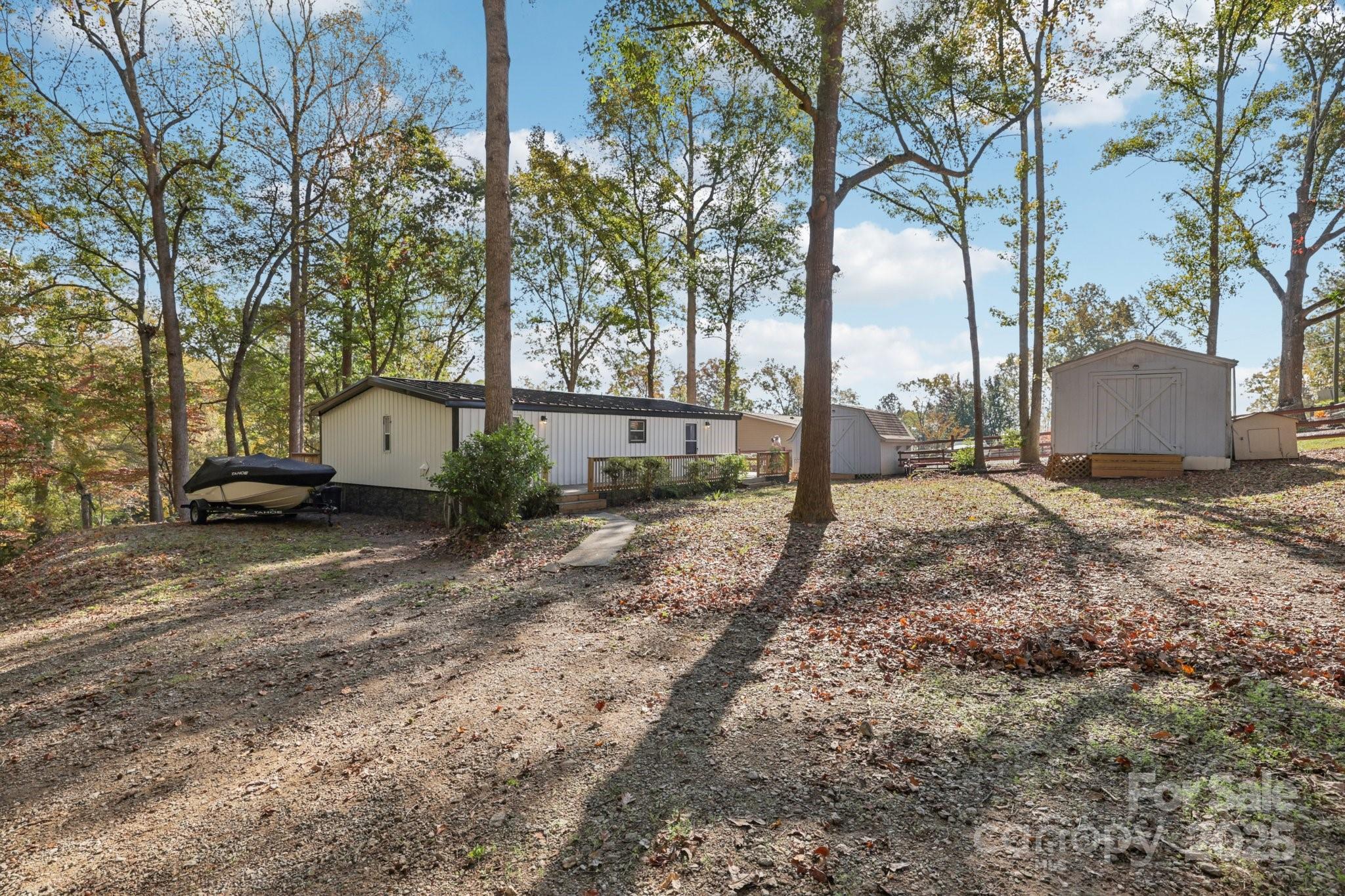 1269 Eastcreek Road Fort Lawn, SC 29714 - Photo 3 of 44 a view of a yard with a house and trees around