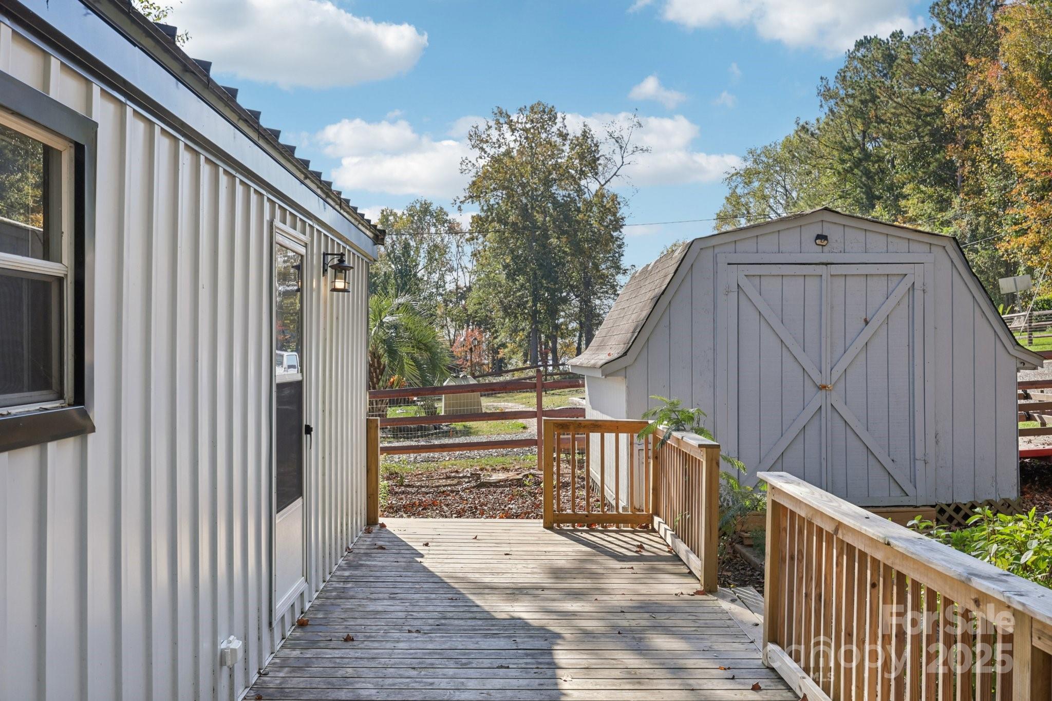 1269 Eastcreek Road Fort Lawn, SC 29714 - Photo 4 of 44 a view of backyard with small cabin and wooden fencing