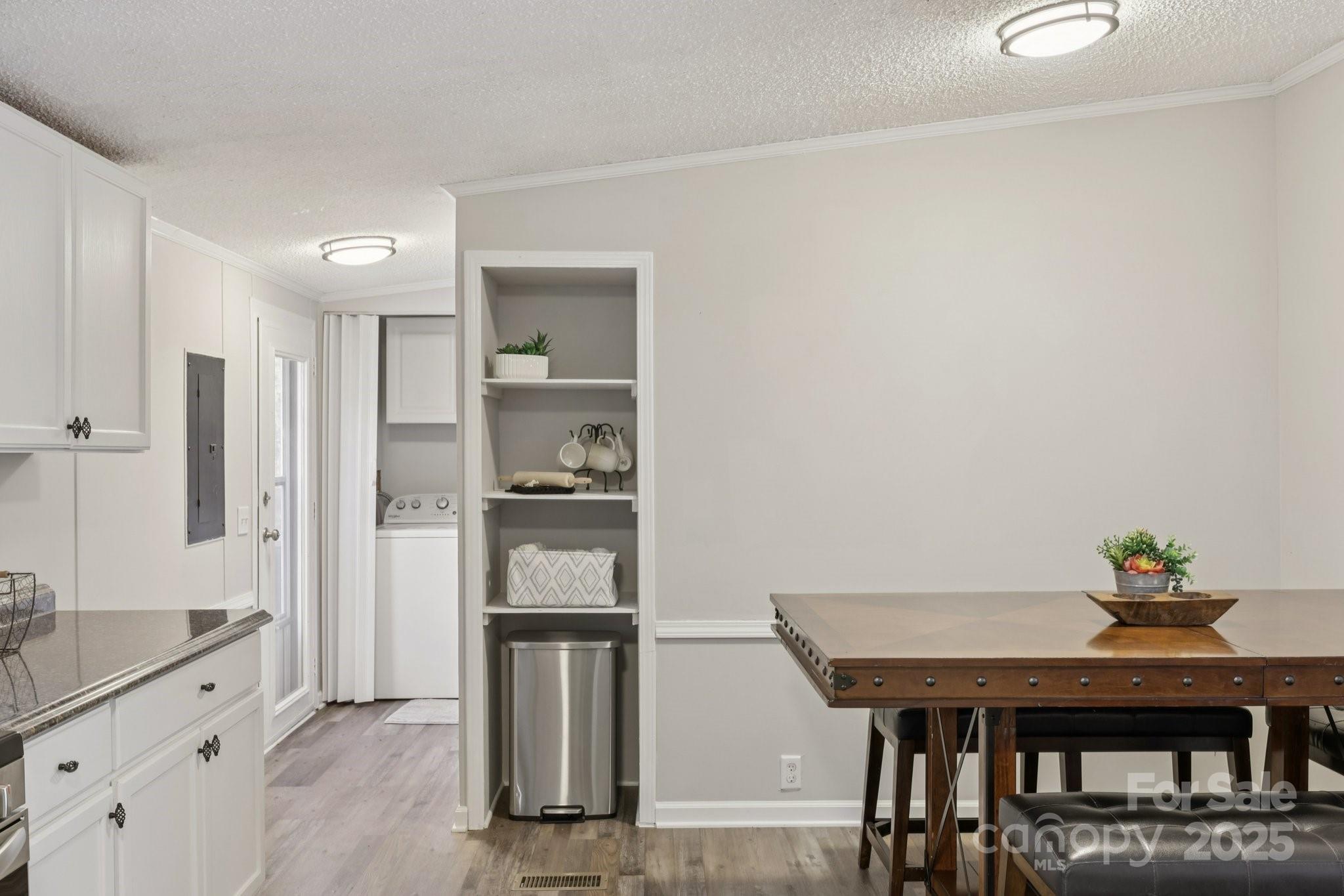 1269 Eastcreek Road Fort Lawn, SC 29714 - Photo 7 of 44 a kitchen with stainless steel appliances refrigerator dining table and chairs