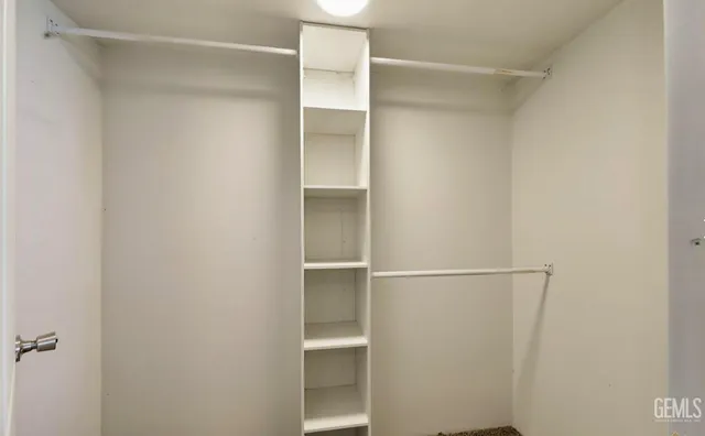 a view of an empty walk in closet