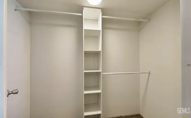 a view of an empty walk in closet