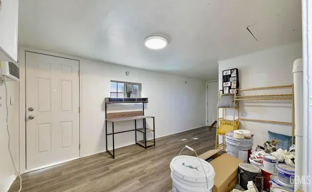 a living room with furniture and a lamp