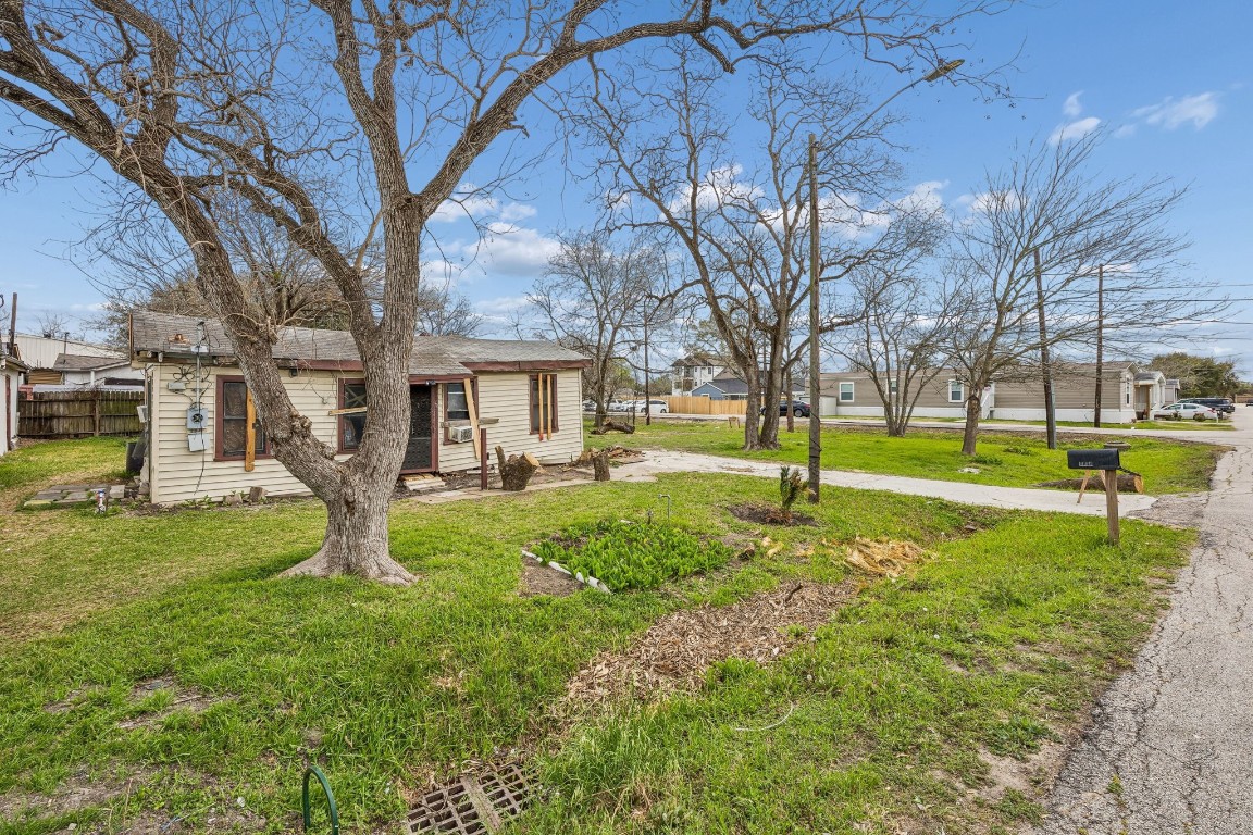 4107 B Street Houston, TX 77072 - Photo 13 of 15 a house view with a garden and trees