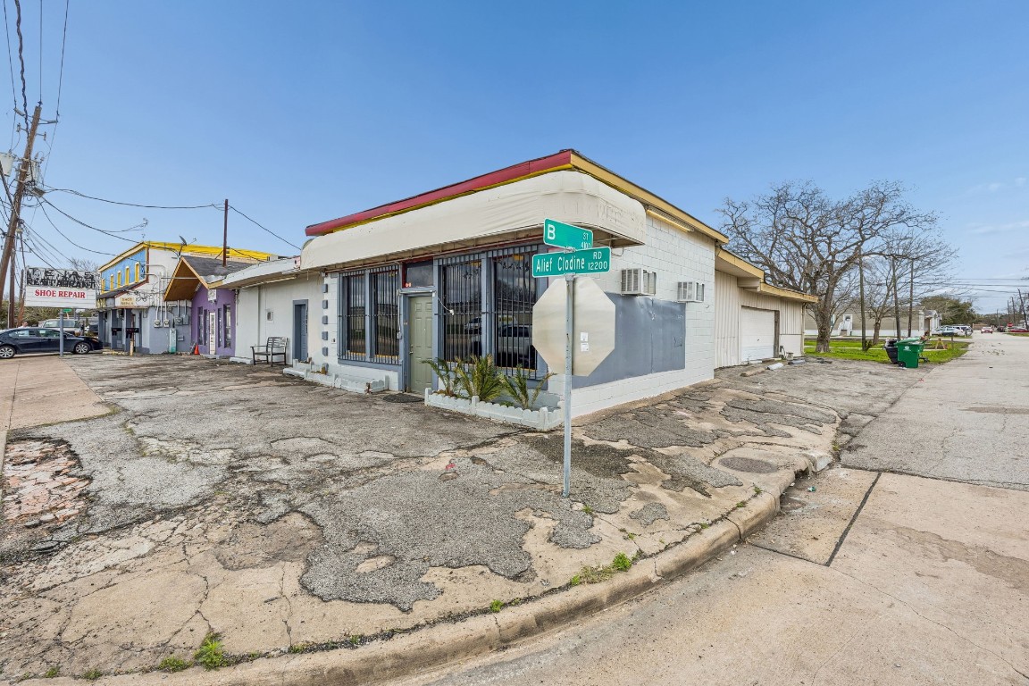 4107 B Street Houston, TX 77072 - Photo 10 of 15 a front view of a house with a yard and potted plants
