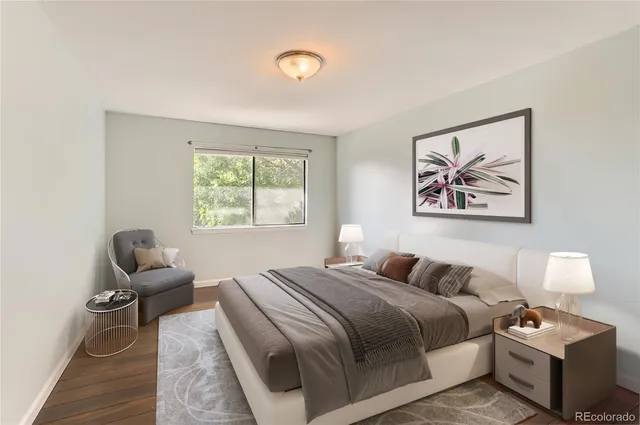 a bedroom with a bed and a couch