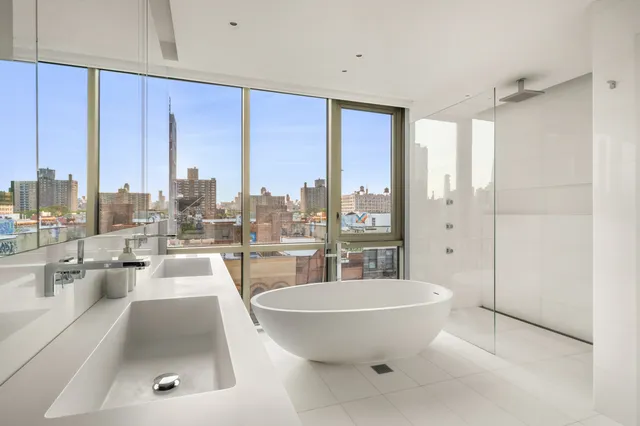 a bathroom with a toilet a sink and a bathtub