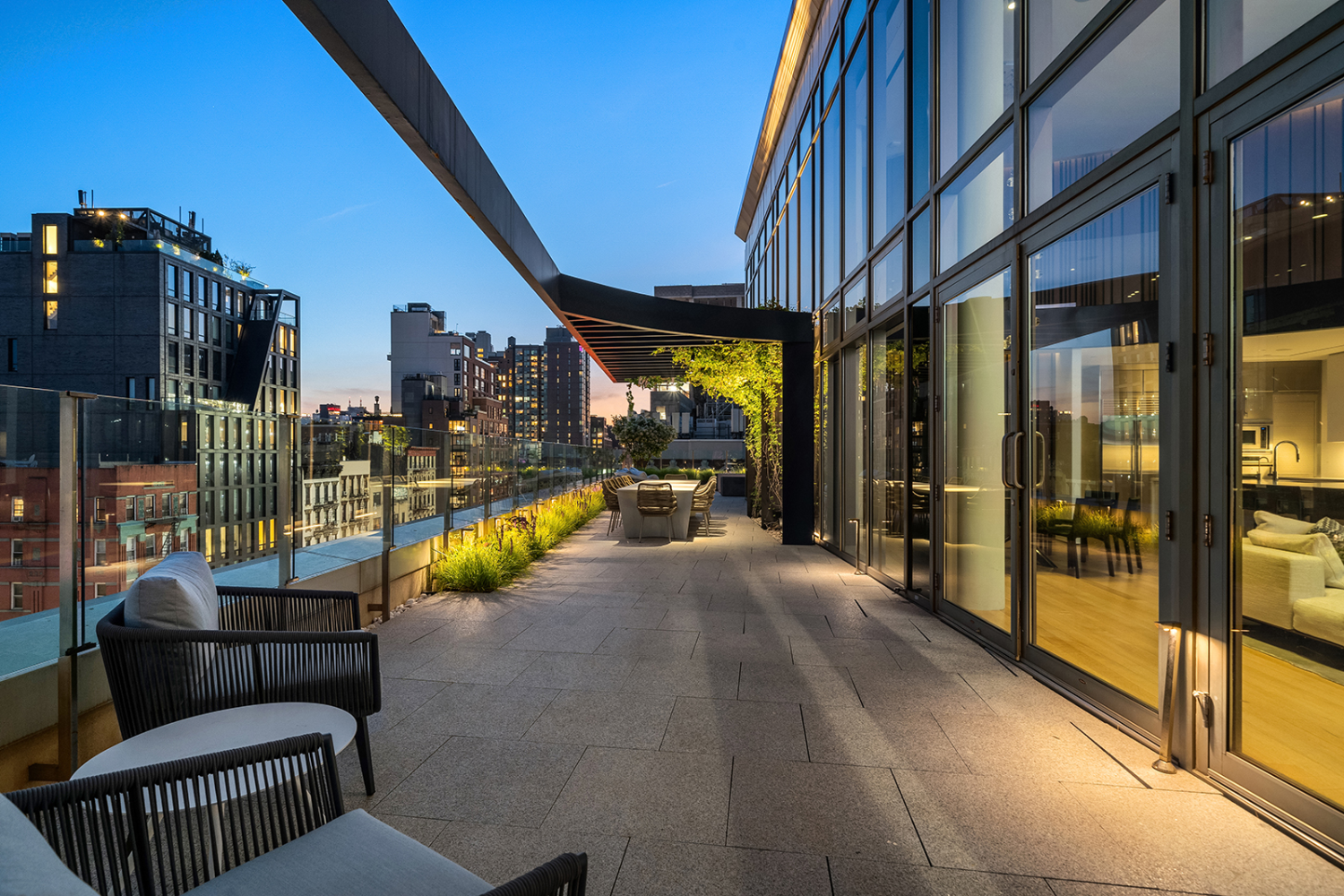 1 Avenue B, Unit PH1 Manhattan, NY 10009 - Photo 25 of 30 a view of a patio with couches and table and chairs and potted plants