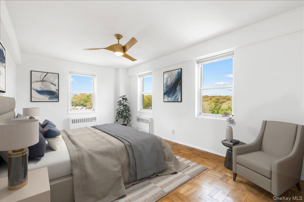 900 Palmer Road, Unit 10D Bronxville, NY 10708 - Photo 12 of 18 a bedroom with a bed couch and window