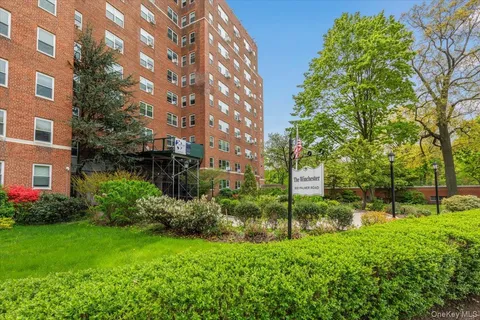 a view of a garden with a building