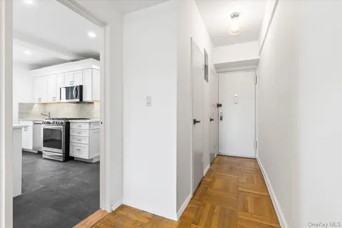 a view of a kitchen from the hallway