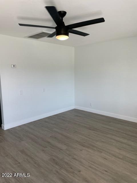 830 East Turney Avenue, Unit 9 Phoenix, AZ 85014 - Photo 14 of 28 a view of a big room with wooden floor