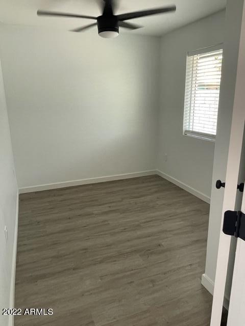830 East Turney Avenue, Unit 9 Phoenix, AZ 85014 - Photo 17 of 28 wooden floor in an empty room