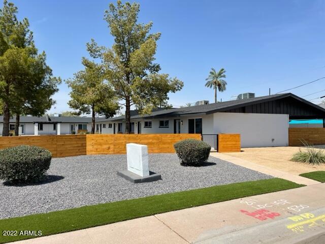 830 East Turney Avenue, Unit 9 Phoenix, AZ 85014 - Photo 2 of 28 a front view of a house with a yard