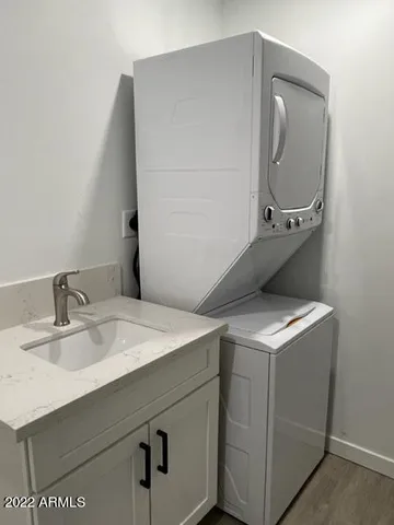 a view of a room with wooden floor and a window