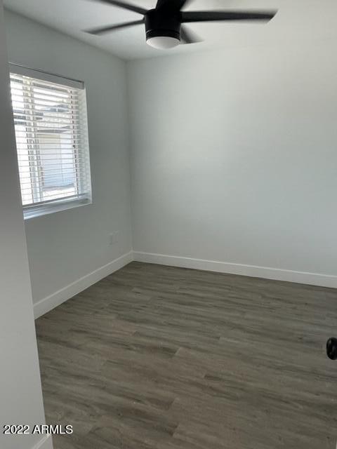 830 East Turney Avenue, Unit 9 Phoenix, AZ 85014 - Photo 23 of 28 a view of a room with wooden floor and a window