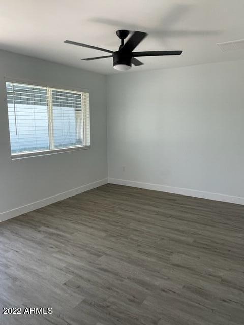 830 East Turney Avenue, Unit 9 Phoenix, AZ 85014 - Photo 24 of 28 wooden floor in an empty room