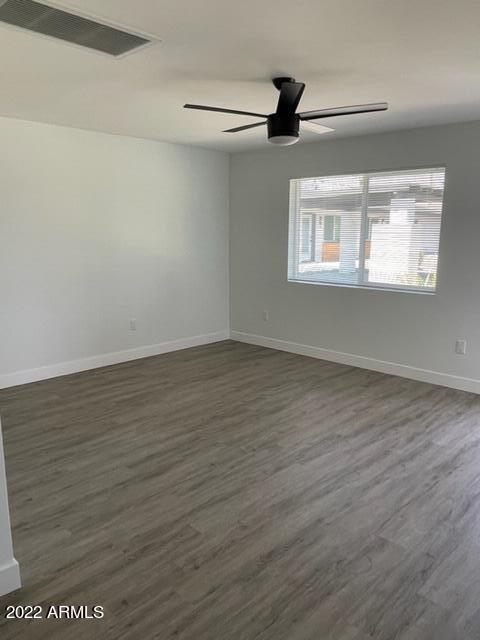 830 East Turney Avenue, Unit 9 Phoenix, AZ 85014 - Photo 26 of 28 wooden floor in an empty room