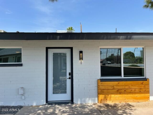 830 East Turney Avenue, Unit 9 Phoenix, AZ 85014 - Photo 3 of 28 a view of a balcony with a floor to ceiling window