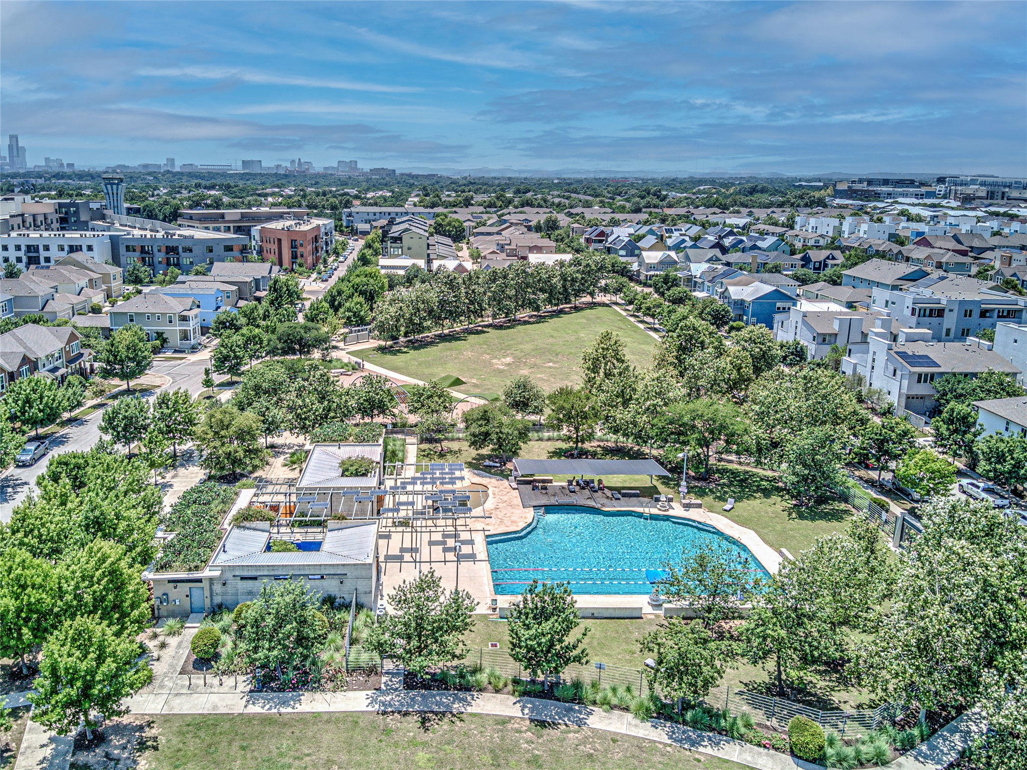 2805 McCurdy Street, Unit 14 Austin, TX 78723 - Photo 38 of 40 An aerial perspective reveals a vibrant community with an inviting pool, recreational green space, and contemporary residences.
