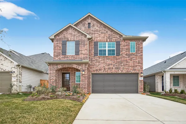 a front view of a house with yard