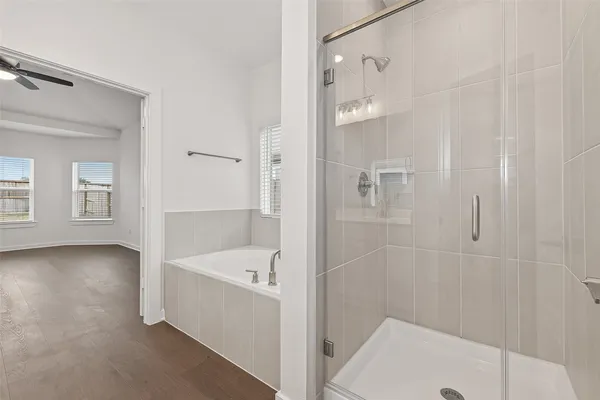a bathroom with a bathtub and a shower