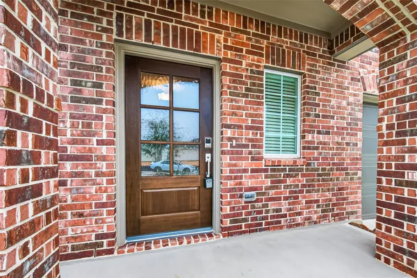 a view of front door of house with a street