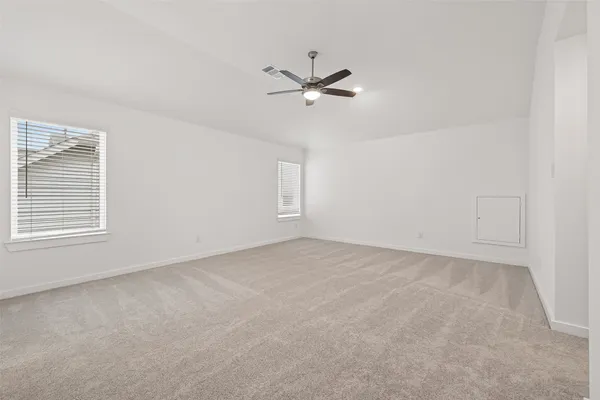 a view of an empty room with a window